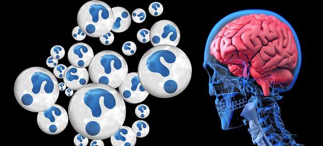 brain in transparent head, next to numerous question marks in bubbles.